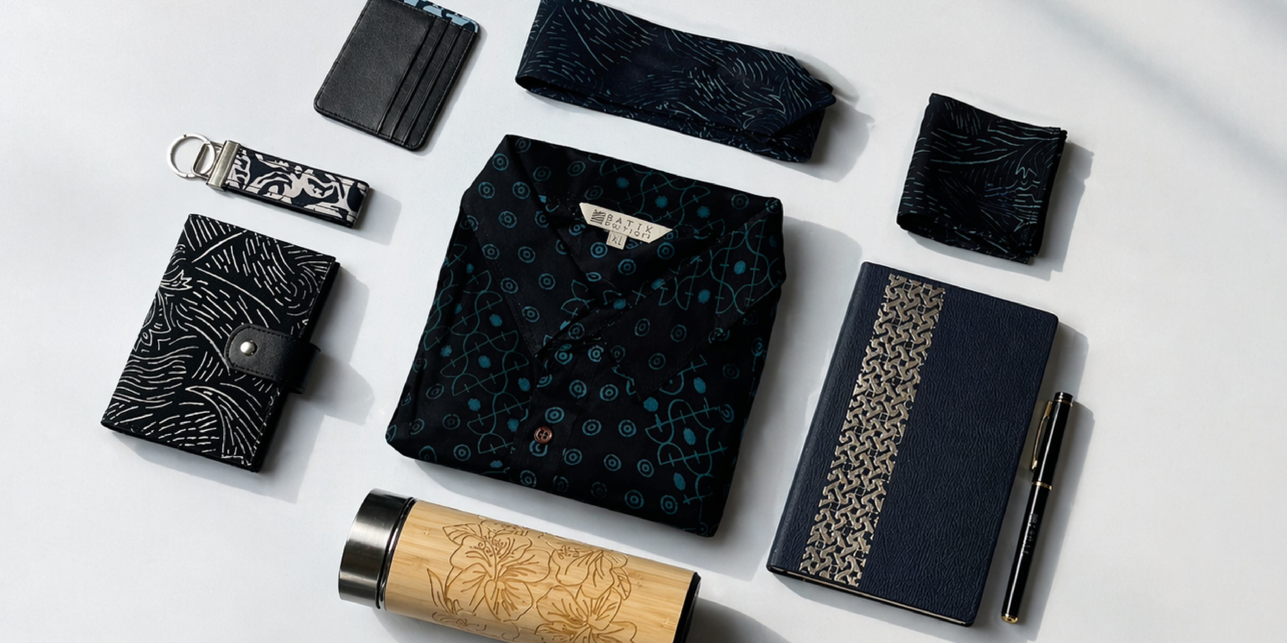 Custom Malaysian batik design used across corporate gifts and apparel
