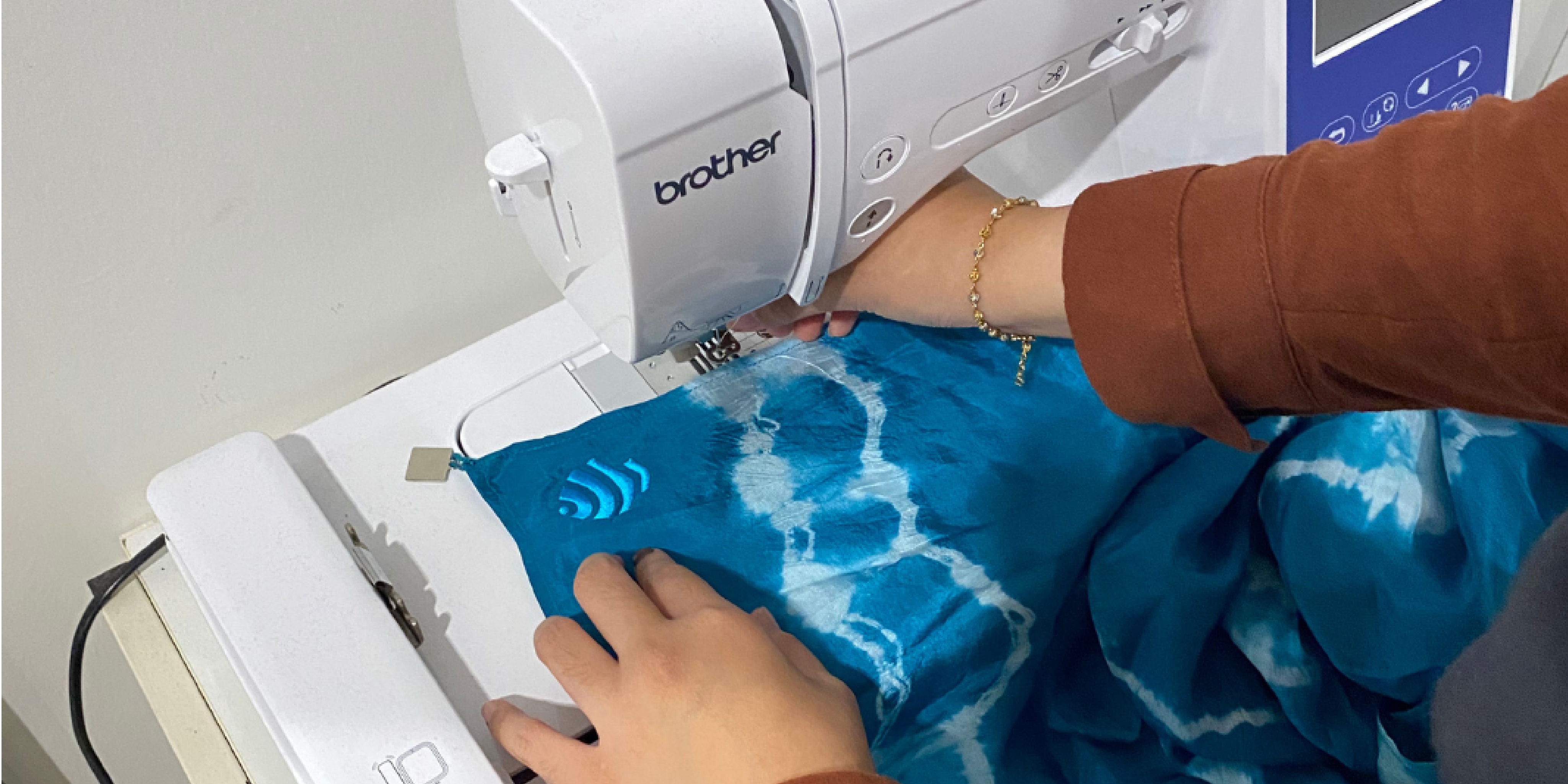 Artisan creating Malaysian batik fabric as part of sustainable production
