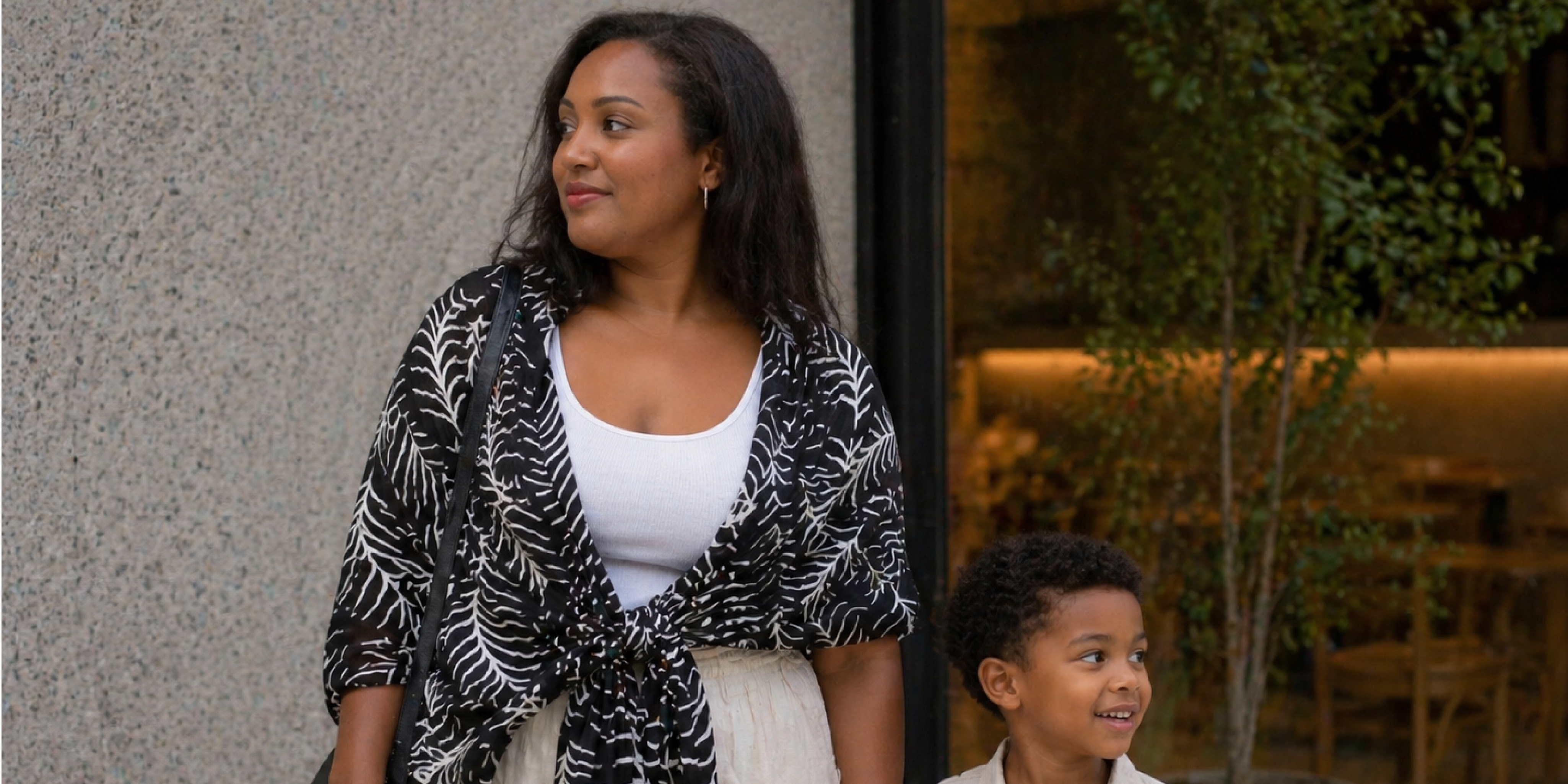 Mother wearing a Malaysian batik scarf in a modern lifestyle setting