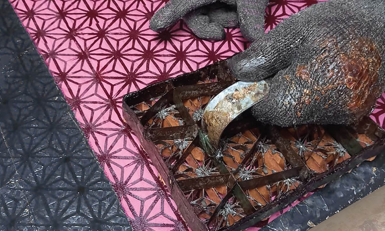 Skilled batik artisans carefully crafting traditional patterns using time-honored techniques.