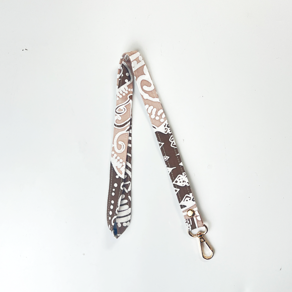 Patterned lanyard with a metal clip on a white background