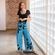 Batik Wide Leg Trousers - Azure Blooming Lace being worn in a lifestyle photo 