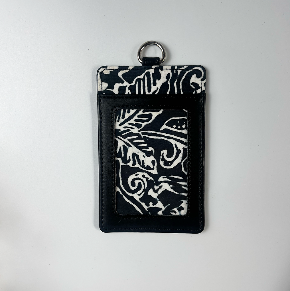 Black and white patterned keychain pouch on a light gray background