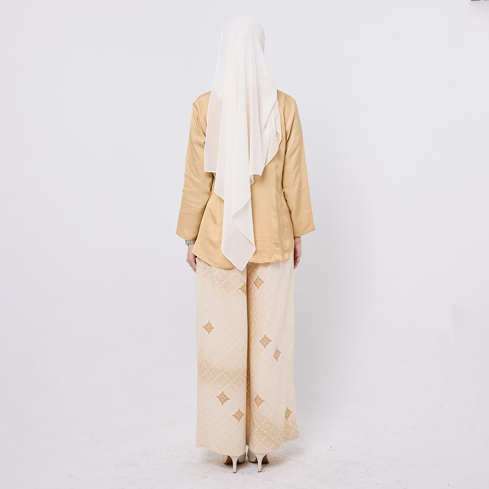 Person wearing a beige outfit with a white hijab on a white background