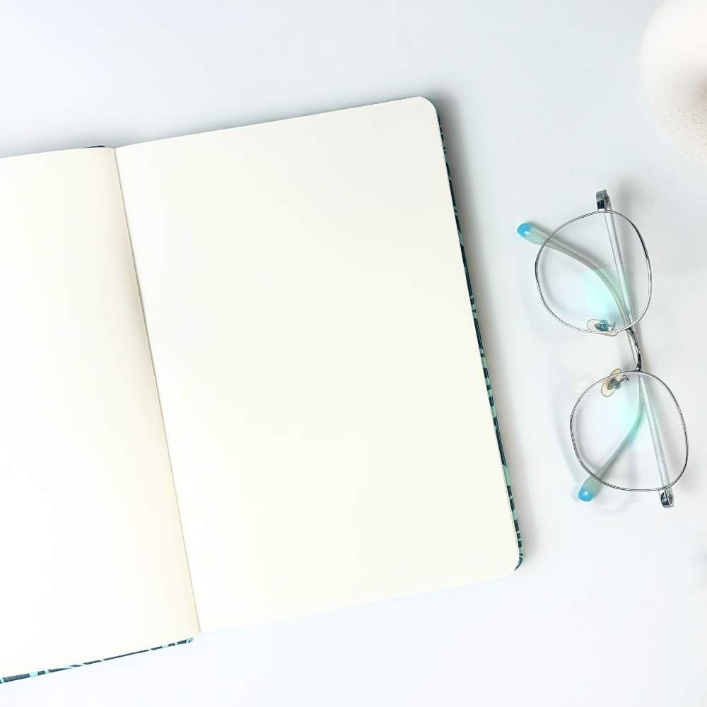 Batik-Inspired Notebook & Pen in Teal Ukir showing a black page 