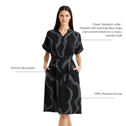 Woman wearing Batik Dress with Black chain-inspired print
