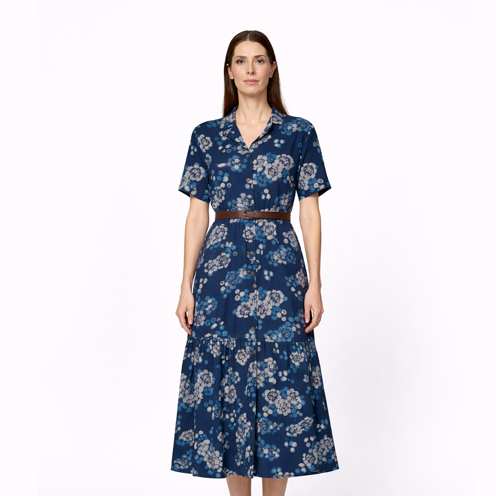 Woman wearing a blue floral dress on a white background