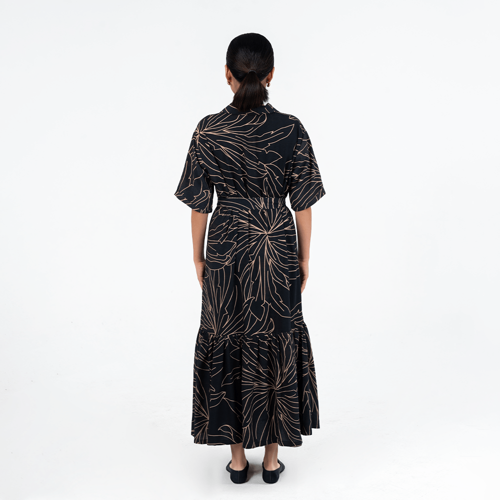 Back view of Batik Boutique’s Onyx Palma Button-Up Dress highlighting the batik motif and flowy A-line cut