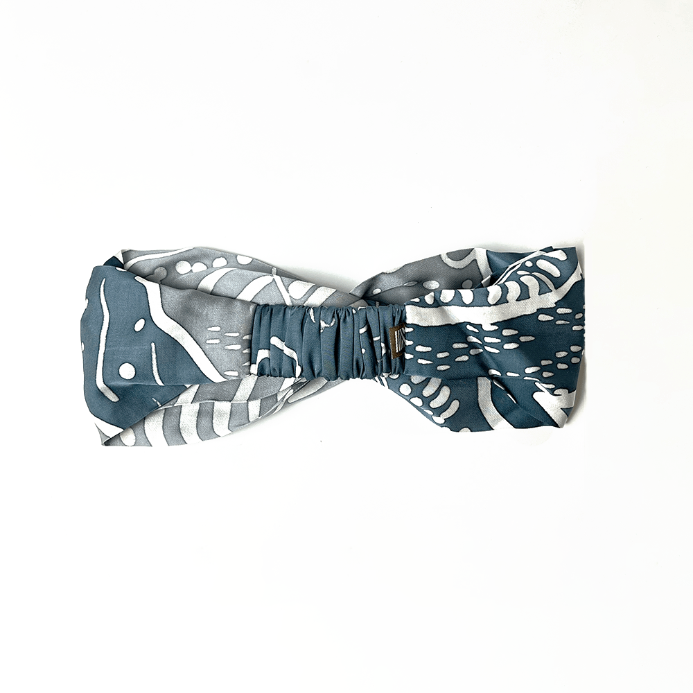Blue and white patterned bow tie on a white background