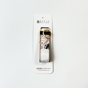 Keychain with lace design on a white background, featuring the Batik Boutique brand.