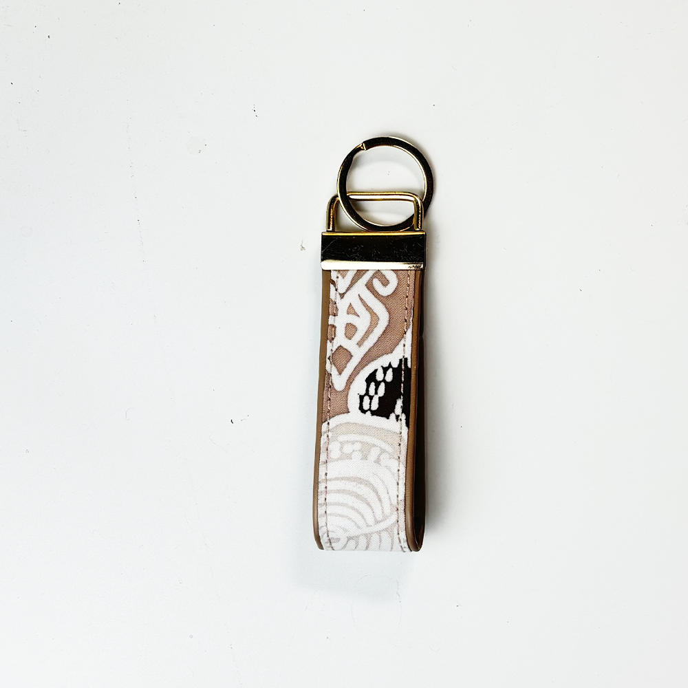 Keychain with a patterned strap on a white background