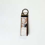 Keychain with a patterned strap on a white background