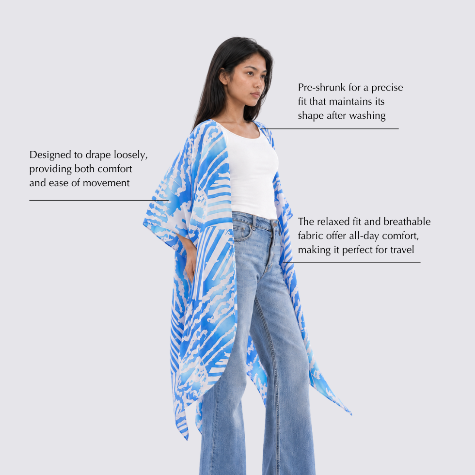 Woman wearing a blue and white patterned kimono-style garment on a light gray background