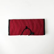 Red snakeskin travel pouch with a sleek and functional design, perfect for keeping your items safe while traveling.
