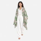 Lady facing front wearing green printed batik scarf