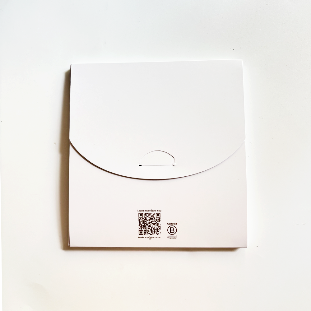 White envelope with a QR code and logo on a white background