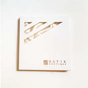 Framed artwork with geometric design and 'Batik Boutique' logo on a white background