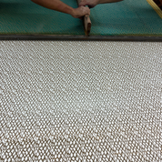 People Applying Wax onto the fabric