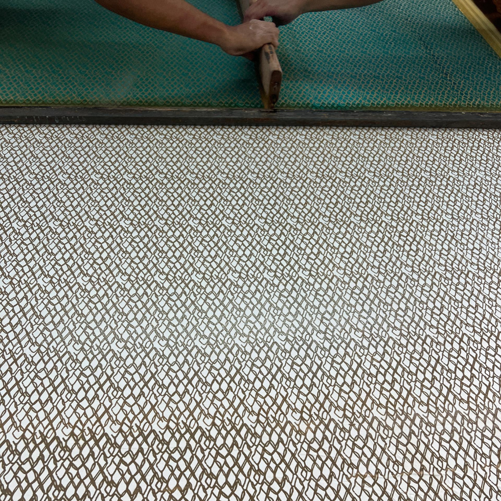 People Applying Wax onto the fabric