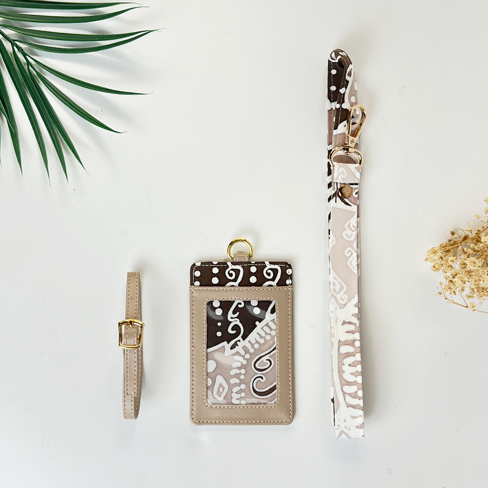 Set of keychain, card holder, and lanyard with decorative patterns on a light background.