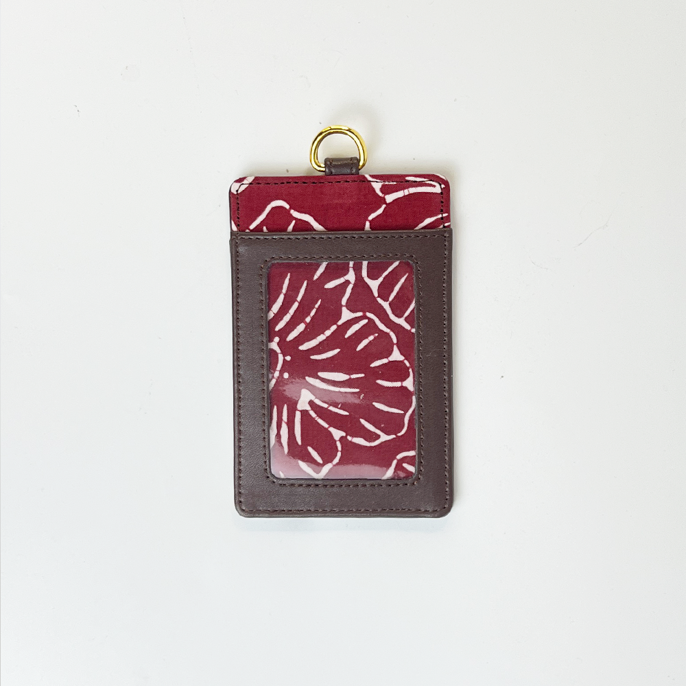 Card holder with red floral pattern on a white background