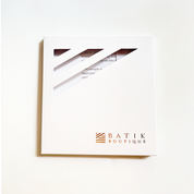 Framed artwork with 'Batik Boutique' logo on a white background