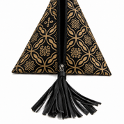 A black and gold patterned triangular clutch bag with a black leather tassel zipper pull, shown against a plain white background.