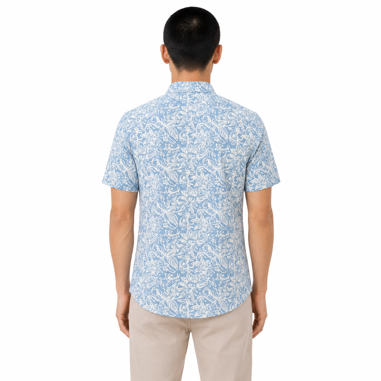 Man wearing a blue patterned shirt on a white background