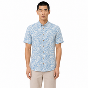 Man wearing a blue floral patterned shirt on a white background