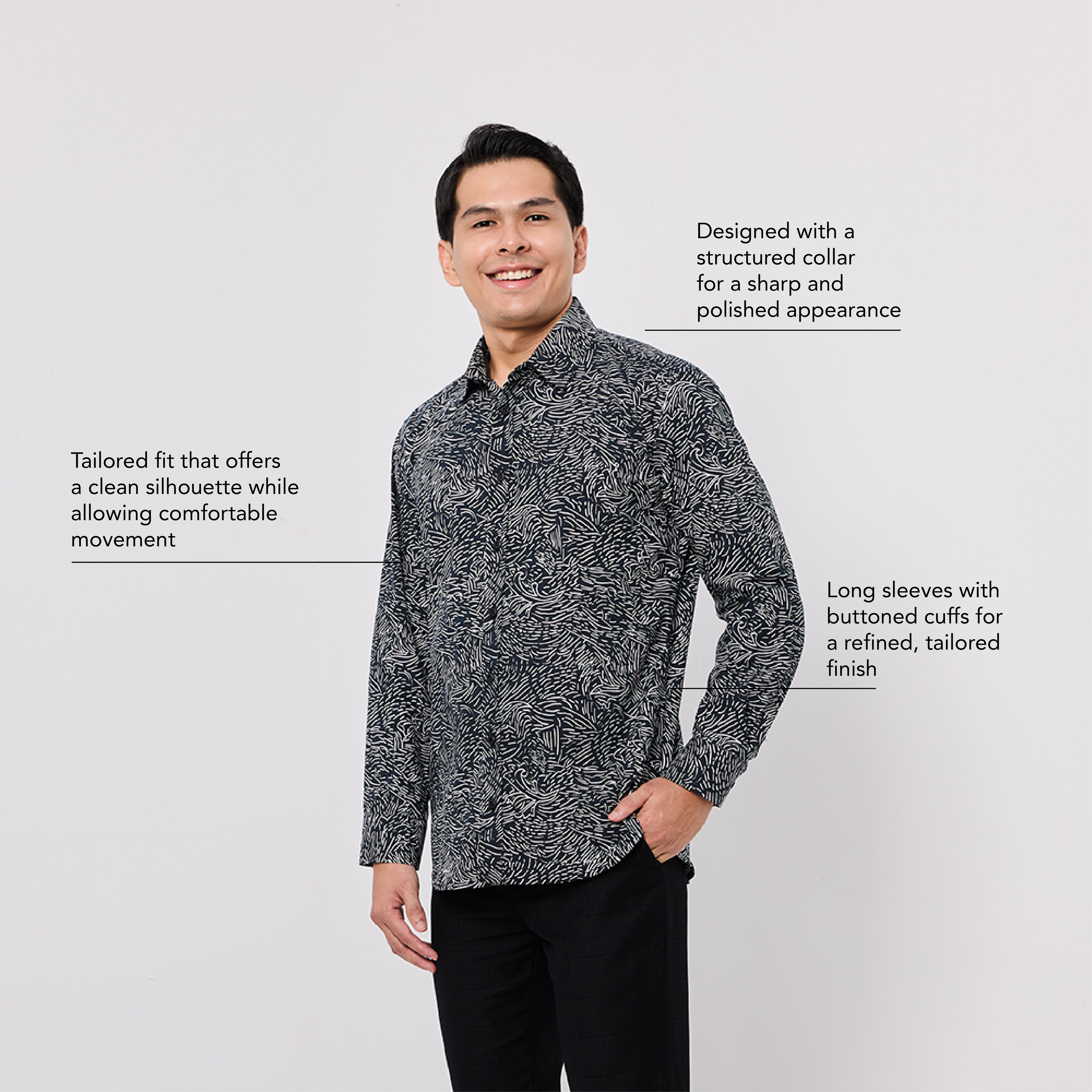 Man wearing a patterned shirt with text describing its features on a white background