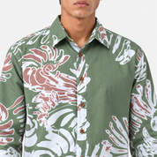 Close-up of a button-front shirt with an abstract reef pattern in green