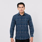 Man wearing a blue patterned shirt on a white background