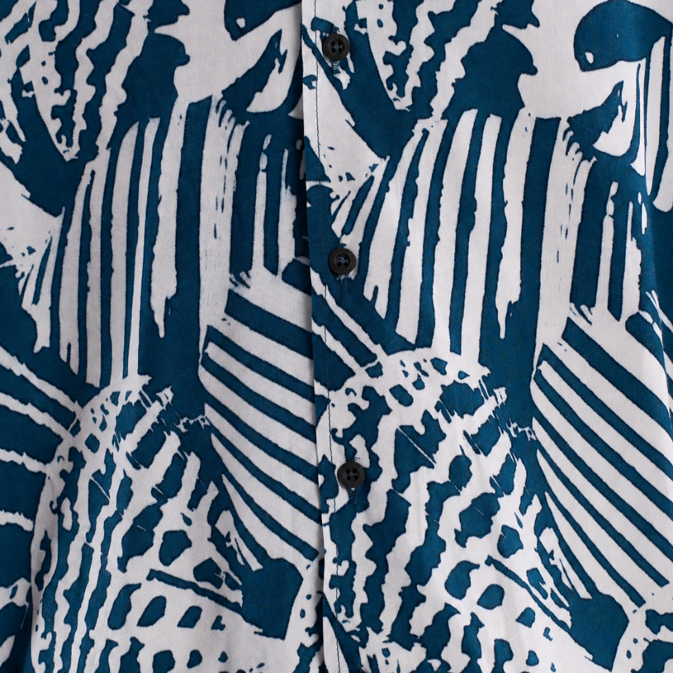 Close up of the blue printed batik shirt with black buttons