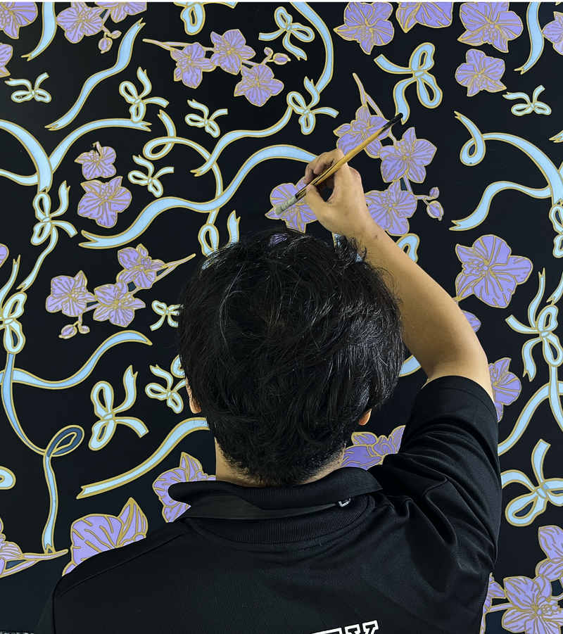 Image of man painting batik