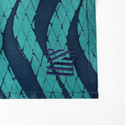 Batik Neck Tie & Pocket Square (Silk Cotton) - Teal Snakeskin shown with the Batik boutique embroidery design 