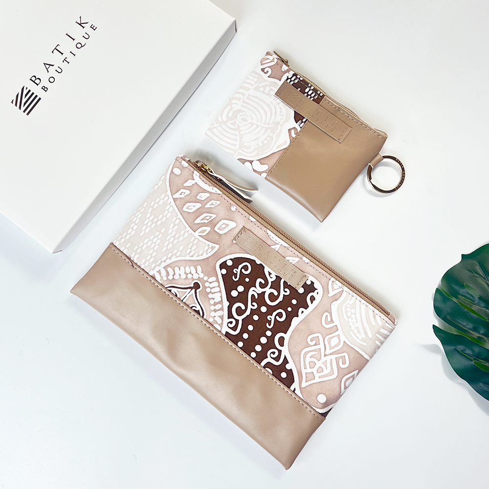 Two batik-patterned pouches on a white background with 'Batik Boutique' branding.