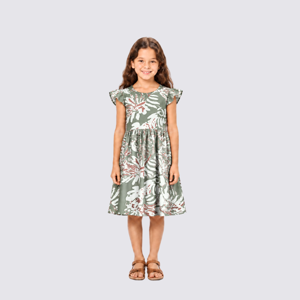 Girl facing front wearing green batik dress