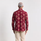 back view of the ruby songket shirt in men's long sleeve in a whitebox setting 