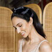 Woman wearing Batik Boutique’s Jet Chain headband, styled with natural makeup and neutral outfit, showcasing elegant batik accessory