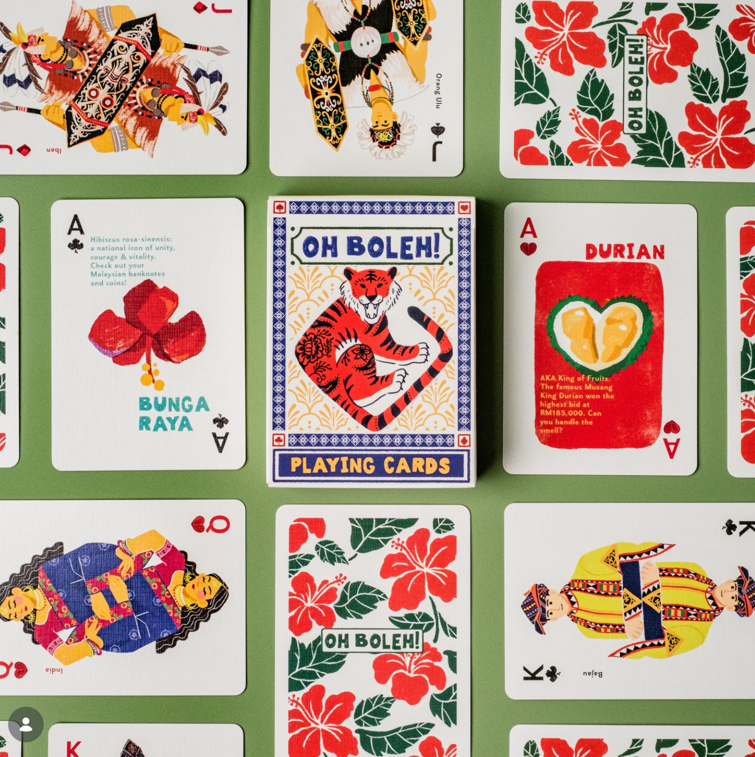 Collection of playing cards with colorful designs on a green background