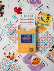 Pack of 'Oh Bolleh!' playing cards on a background of other playing cards with colorful designs.