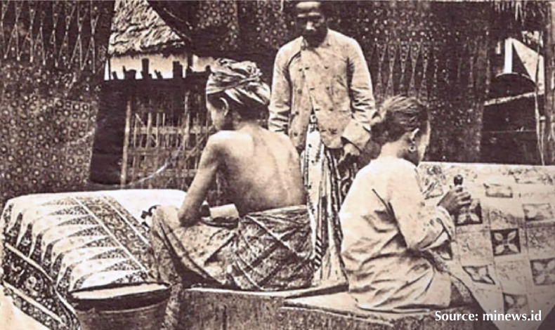 Local artisans creating handcrafted batik using traditional techniques passed down through generations.