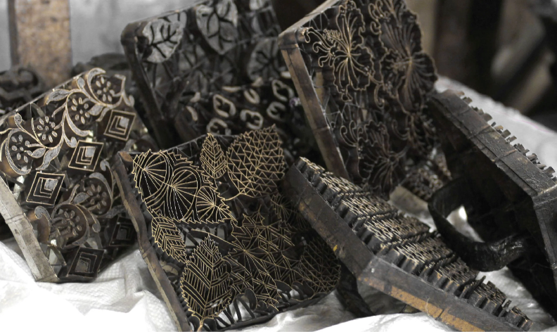 Local artisans creating handcrafted batik using traditional techniques passed down through generations.