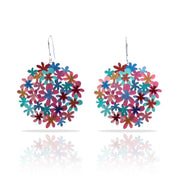 Colorful flower-shaped earrings on a white background